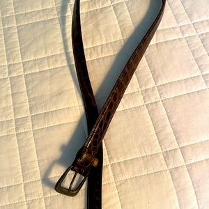 Silver buckle croc belt.